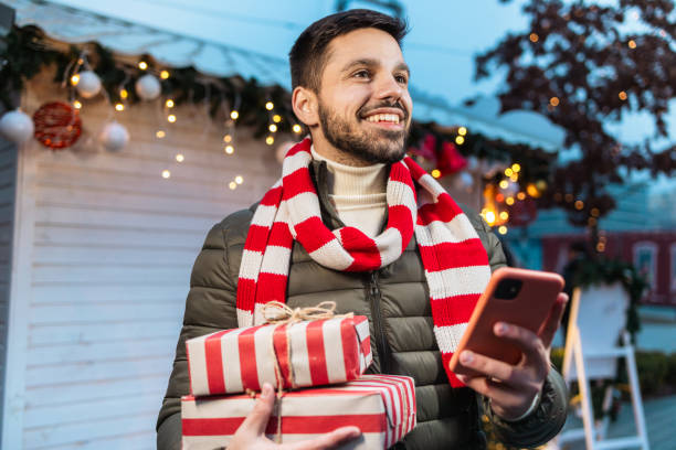 istock Christmas magic. Young man with Christmas presents 1659939961