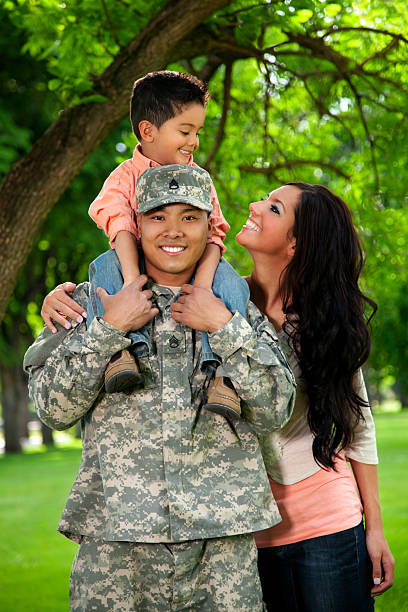 istock Army Family Series: Young US Soldier with Wife & Son 165996096
