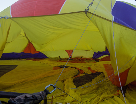 Bristol, UK: August 13, 2016: Flying a balloon at the Bristol International Balloon Fiesta. The annual event has become Europe’s largest hot air balloon festival. 