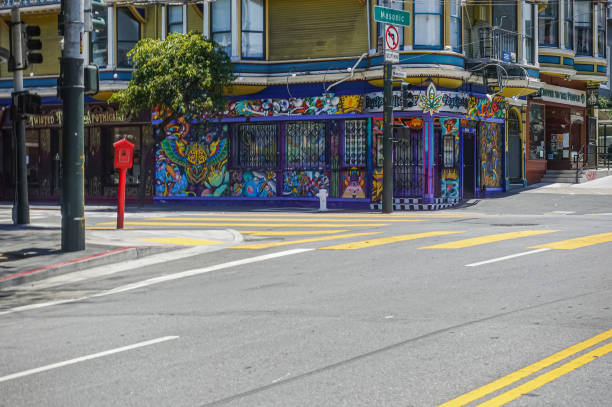 San Francisco, CA, USA - July 12, 2023: Corner Masonic and Haight streets with colorfully painted corner shop selling Psychelics. Neighbor is famous Coffee for the people store