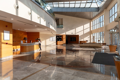 empty marble floor with abstract architecture exterior for copy space.