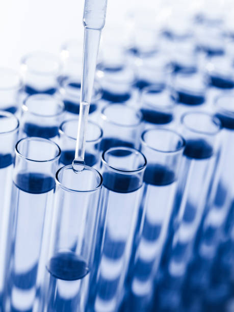 istock Droplet Falling from Pipette into Test Tube. 1659993464