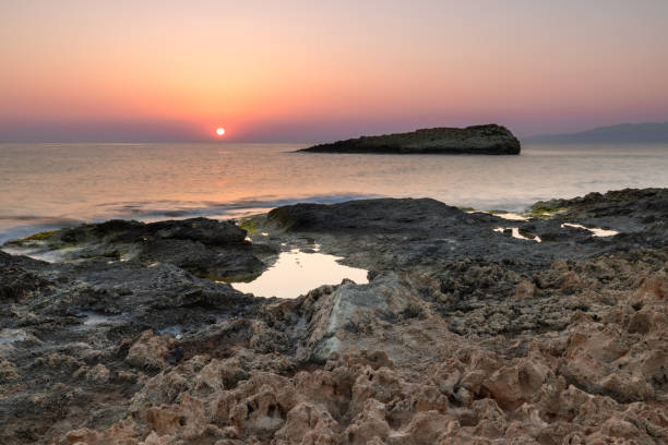 istock Sunrise's Glow: Illuminating Coastal Clefts in Crete's Morning Light 1659997775