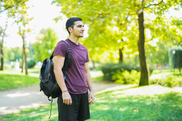 istock young man in the park looking at the horizon 1659999442