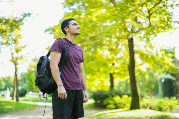 istock young man in the park looking at the horizon 1660001029