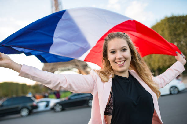 tourist in paris with a french flag