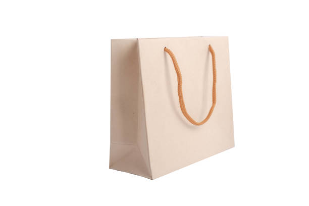 istock Brown paper bags for packing items placed on a white background. 1660037208
