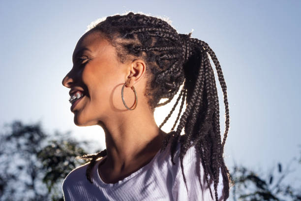 istock Woman posing outdoors with afro hairstyle - side view 1660042874