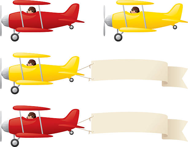 Four red and yellow biplanes, two with blank banners  Yellow and red biplanes, towing your message. toy airplane stock illustrations