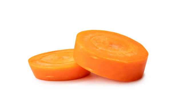 istock Fresh beautiful carrot slices in stack isolated on white background Front view. 1660131360
