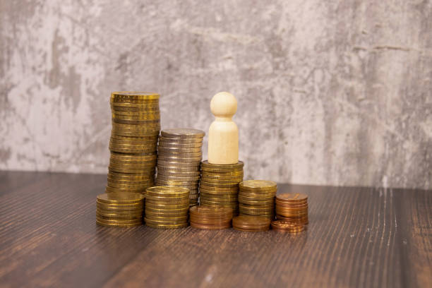 istock Incresing golden coin stacks, isolated on white background 1660139561