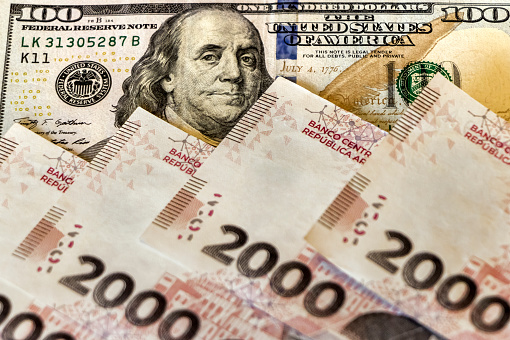 Argentine banknotes of 2000 pesos and american one hundred dollar bill.