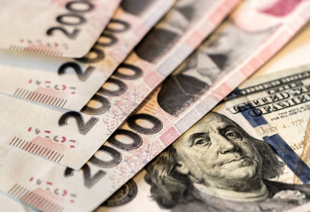 istock Argentine pesos and US dollars banknotes. 1660154300