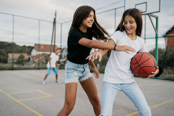 Kids are playing basketball