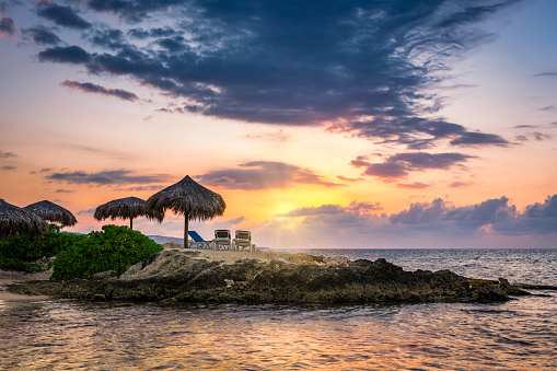 Sunset over a tropical rocky beach in Jamaica