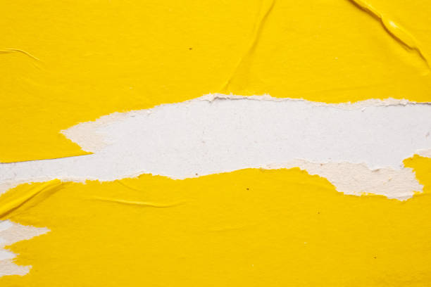 istock Old grunge ripped torn yellow paper poster surface texture background 1660210548