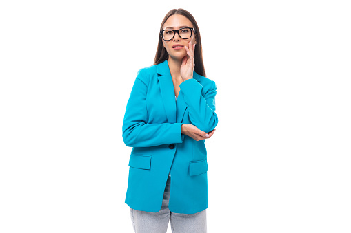 young successful brunette leader woman with long hair in a blue jacket.