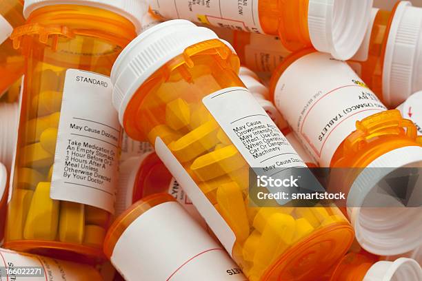 Several Prescription Pill Bottles In A Pile Stock Photo - Download Image Now - Prescription Medicine, Bottle, Pill