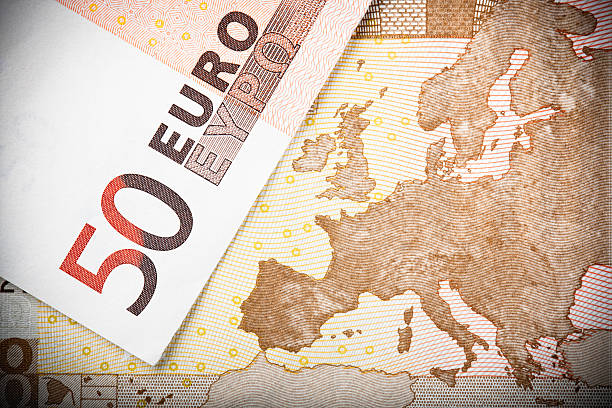 European Map on €50 Note Euro notes close-up:  Macro image of two €50 banknotes, with focus on the map of Europe. european union currency european union euro note currency europe stock pictures, royalty-free photos & images