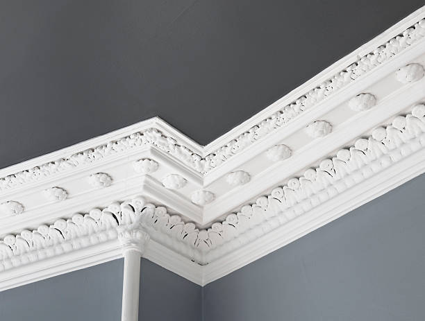 Traditional Ceiling Cornice Moulding Close up of a traditional, intricate Georgian cornice moulding on the interior of an Edinburgh flat. moulding trim photos stock pictures, royalty-free photos & images