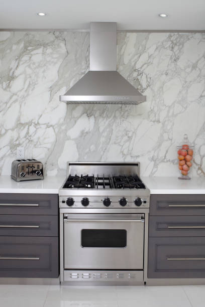 Luxury Kitchen Interior of modern luxury kitchen in North American private residence. stove stock pictures, royalty-free photos & images