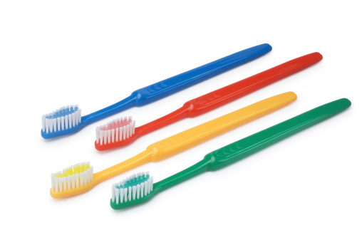 Group of colourful, plastic, toothbrushes, isolated on white.