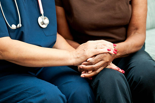 istock Healthcare Worker's Comforting Hands 166025842