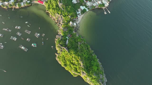 Aerial video of limestone island with blue sea typical of the island waters of Southwest Vietnam, tropical island, Nghe island, Kien Giang province