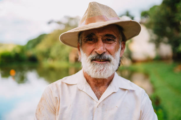 istock Farmer working on farm. Elderly Brazilian man looking at camera. 1660289434
