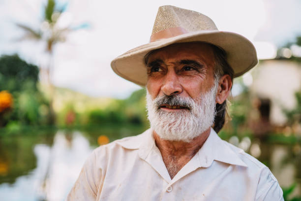 istock Farmer working on farm. Elderly Brazilian man. 1660289473