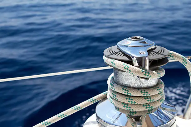 Close up and selective focus on the winch used on sailing boats.