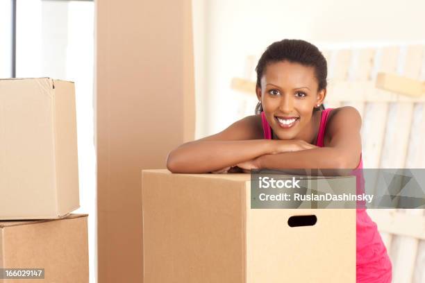 Moving Day Boxes Stock Photo - Download Image Now - 20-24 Years, 20-29 Years, 25-29 Years