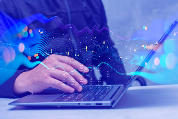 istock Businessman with laptop analyzes financial market data. Futuristic technology solution for business development. Abstract technological background in vibrant colors with blur. 1660292783