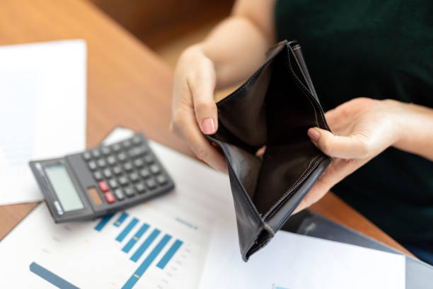 istock Poor woman hand open empty purse looking for money 1660294934