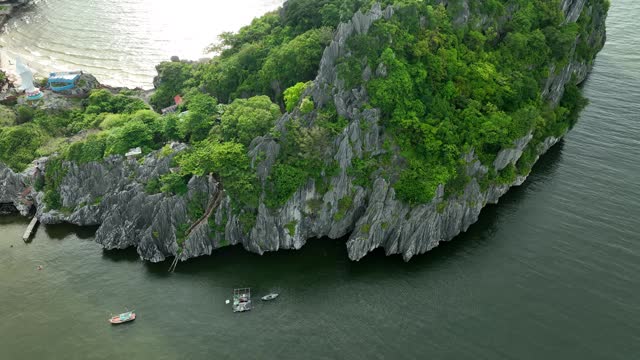 Landscape of limestone mountains and overgrown trees, Nghe island, Kien Giang province