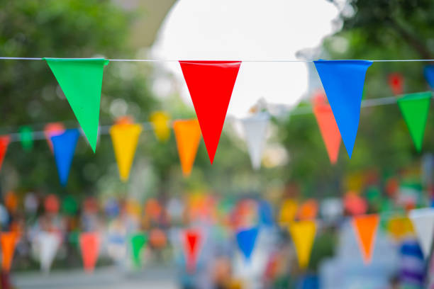 istock Decorative multi-colored triangle flags against the background at the festival in Thailand. 1660319727