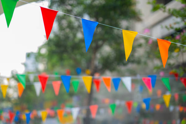 istock Decorative multi-colored triangle flags against the background at the festival in Thailand. 1660320236