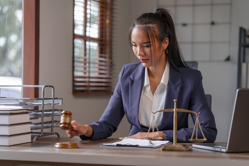 Asian female people in formal suit with digital legal consultation, business executives with online attorney, e-meeting with lawyer, virtual law consultation, corporate legal advisor online
