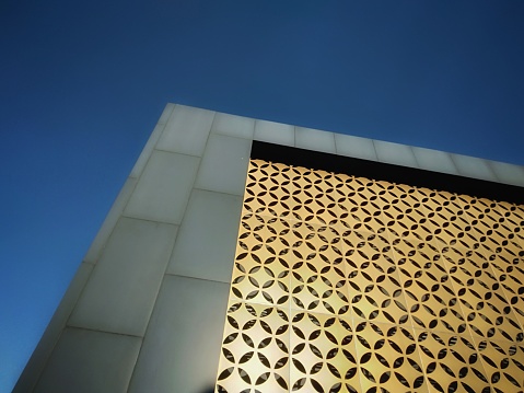 View of metal copper building, Curve architectural design, Abstract facade of architecture skin on blue sky background.
