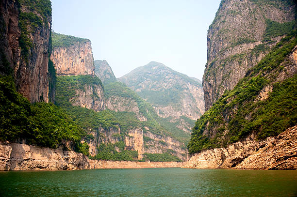 A view of the Yangtze River with cliffs taken from a boat China. View  while cruising along the shores of the mighty Yangtze River. yangtze river stock pictures, royalty-free photos & images