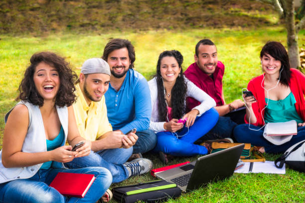 istock Multi-ethnic group of young students studying at university campus 166034956