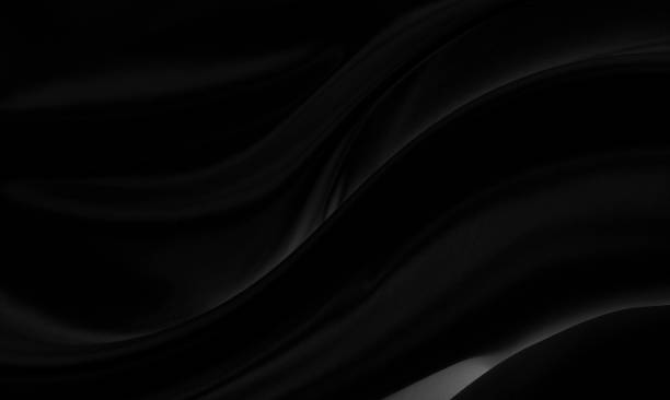 Black gray satin dark fabric texture luxurious shiny that is abstract silk cloth background with patterns soft waves blur beautiful.