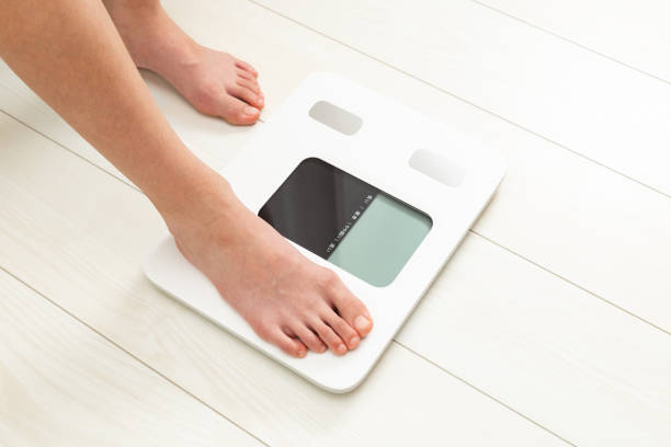 istock A child's feet on a scale. 1660360358