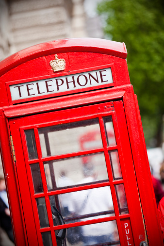 Old red telephone booth, London, England. Shallow DOF, selective focus.