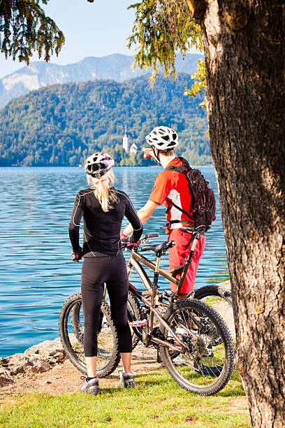 istock Couple resting after mountain biking 166037008