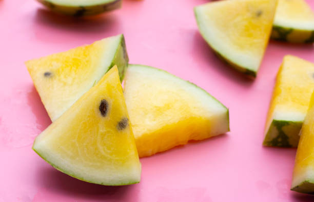 istock Yellow watermelon slices on pink background. 1660382186