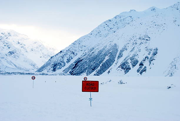Heavy snow blocks the road to the Hooker Valley in the Aoraki National Park. Aoraki meaning Cloud Piercer in Maori, is the Maori name for Mt Cook, the highest mountain in New Zealand. It is in the Southern Alps, the mountain range that runs the length of the South Island of New Zealand.