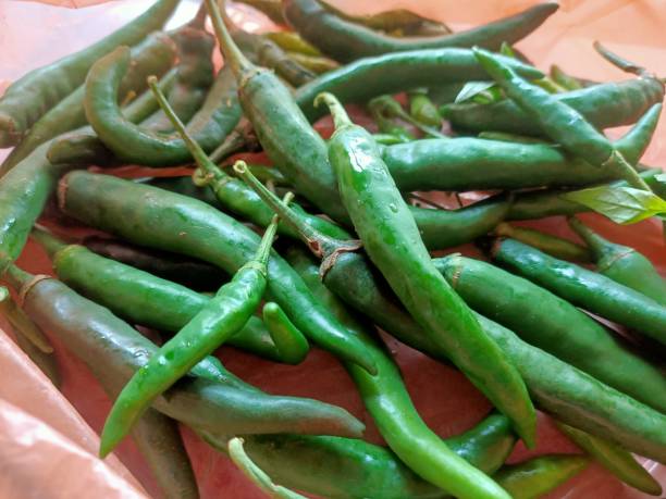 istock Green chilli peppers close-up 1660411741