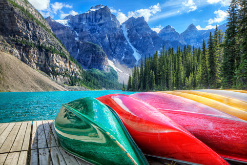 Colourful kayaks on the Moraine Lake, AB, Canada. HDR shot.