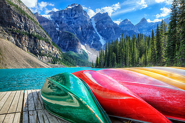 Cayaks on the Moraine Lake Colourful kayaks on the Moraine Lake, AB, Canada. HDR shot. alberta photos stock pictures, royalty-free photos & images